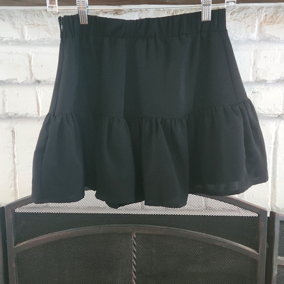 The Impeccable Pig Dresses & Skirts - Cute black mini skirt by Impeccable Pig. Zips up the side, great condition!